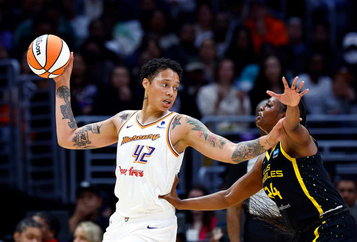 Brittney Griner controls the ball against Joyner Holmes